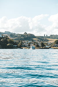 house village near body of water thumbnail