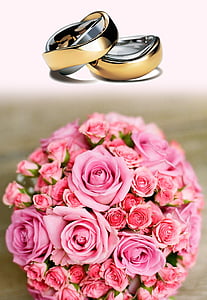 two gold-colored wedding ring and bouquet of rose thumbnail