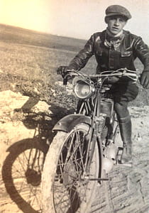 grayscale photography of man riding classic motorcycle thumbnail