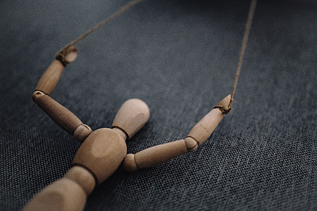 Wooden mannequin in various poses thumbnail