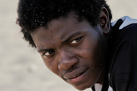 closeup photography of man wearing black top at daytime thumbnail