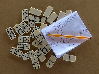 flatlay photography of domino tiles on gray surface thumbnail