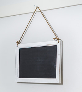 black and white board hanging on wall thumbnail