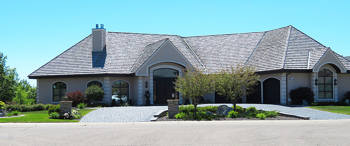 white and gray house during daytime thumbnail