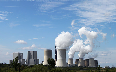 gray and brown factories releasing smoke at daytime thumbnail