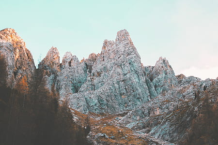 snow filled mountain surrounded by trees thumbnail