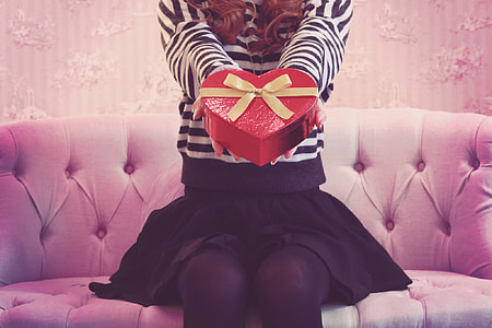 woman holding heart shape gift box thumbnail