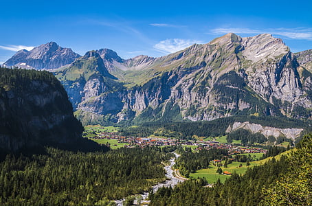 snow covered mountain under blue clouds thumbnail