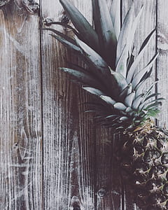 photo of pineapple on brown wooden table thumbnail