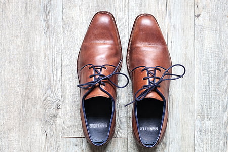 pair of brown leather oxford shoes thumbnail