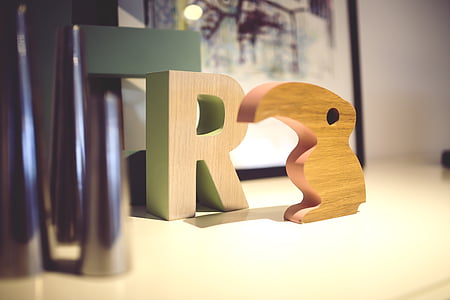 R signage on white desk thumbnail