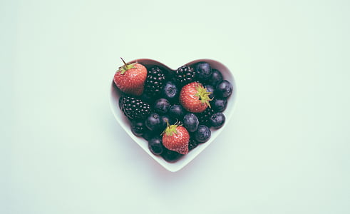 strawberry, blueberry, and blackberry in heart shape bowl thumbnail