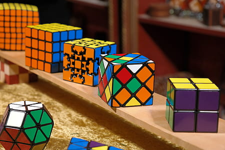 rubik's cubes on brown surface thumbnail