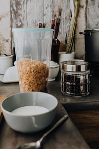 Containers of cereals in kitchen cupboard thumbnail