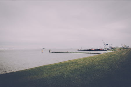 ship near bay at daytime thumbnail