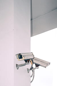 white CCTV camera on wall thumbnail
