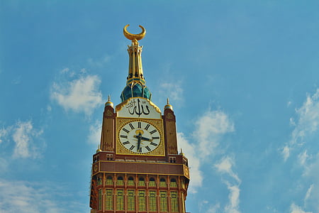 brown building with clock on top thumbnail