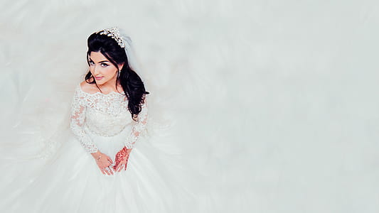 woman wearing white long-sleeved off-shoulder wedding gown thumbnail