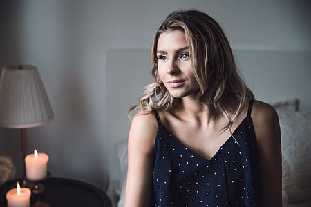 Woman On Bed Looking Away Photo thumbnail