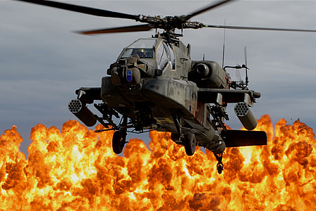 gray apache helicopter with blazing fire background thumbnail