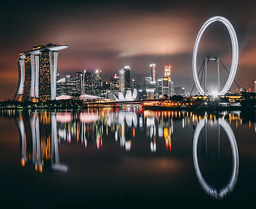 Marine Bay Sands beside body of water during night time thumbnail