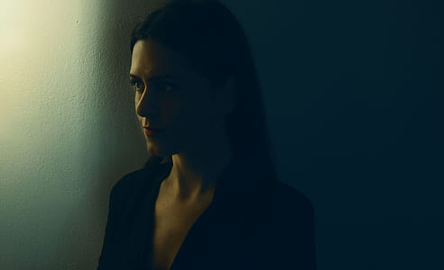 woman wearing black V-neck top thumbnail