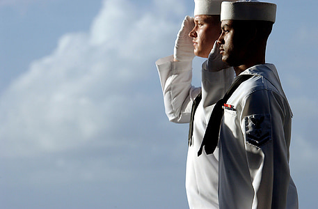 two men wearing white sailing suits thumbnail