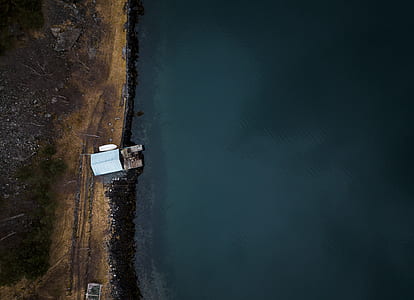 aerial photography of building near body of water thumbnail