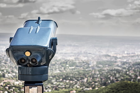 Blue Coin Operated Binocular With City View during Daytime thumbnail