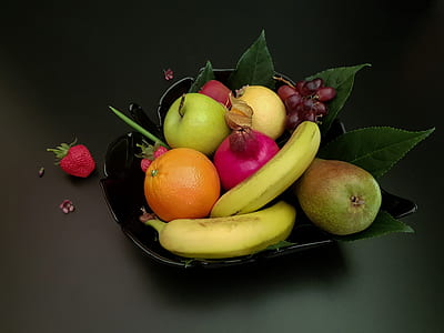 assorted fruits in black fruit bowl thumbnail