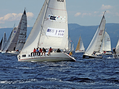 five people sitting on white sailboat thumbnail