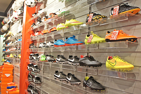 Nike shoe lot on white metal shelf thumbnail