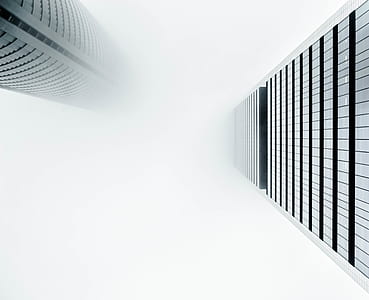low-angle photography of two gray high-rise buildings thumbnail
