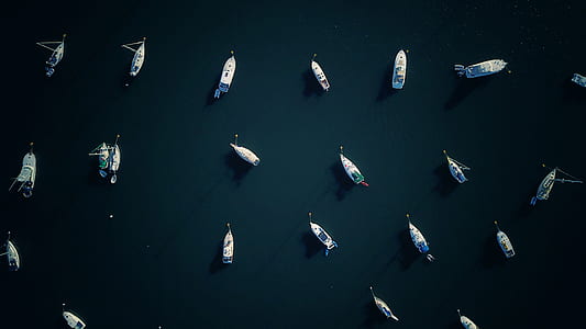 aerial view of boat on body of water thumbnail