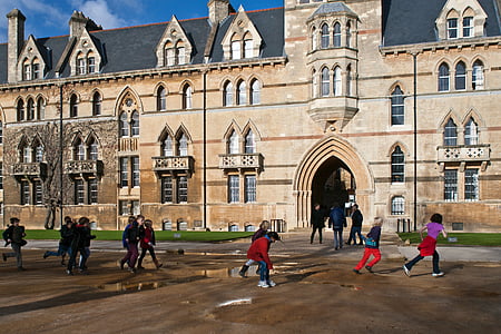 group of children running and playing near building during daytime thumbnail