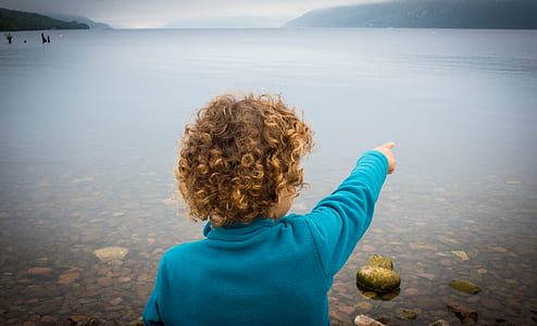 child looking at body of water thumbnail