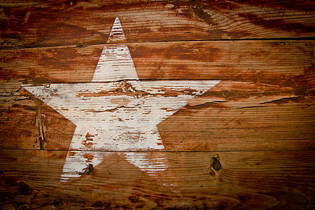 closeup photo of brown and white star-printed board thumbnail