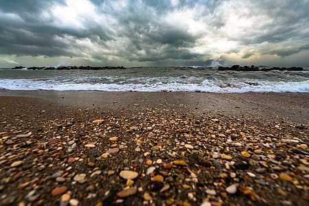 Brown And White Pebbles On Shore thumbnail