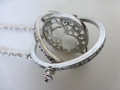silver-colored pendant necklace on white surface thumbnail