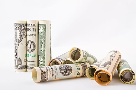 rolled U.S. dollar banknotes thumbnail