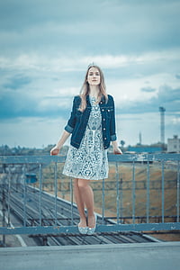 woman in white and black floral dress thumbnail