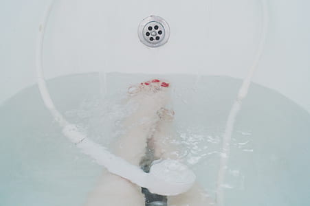 person in bathtub filled with water thumbnail