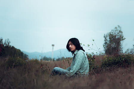 man wearing teal dress shirt on the gray grasses thumbnail