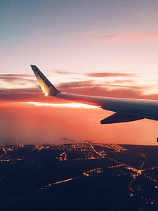 white airplane tail during golden hour thumbnail