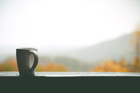 white ceramic mug on white rail thumbnail