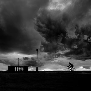 silhouette photo of person biking on street thumbnail