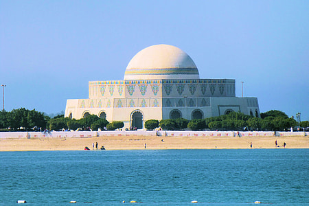 white cathedral near body of water thumbnail