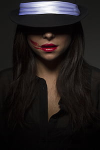 woman wearing black top and hat photo thumbnail