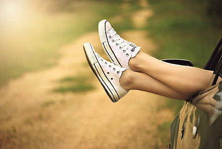 person wearing white low-top sneakers thumbnail