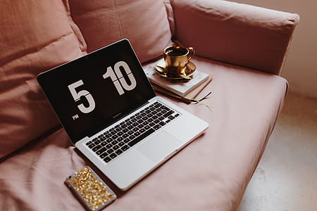 Workplace with a laptop on a pink couch thumbnail